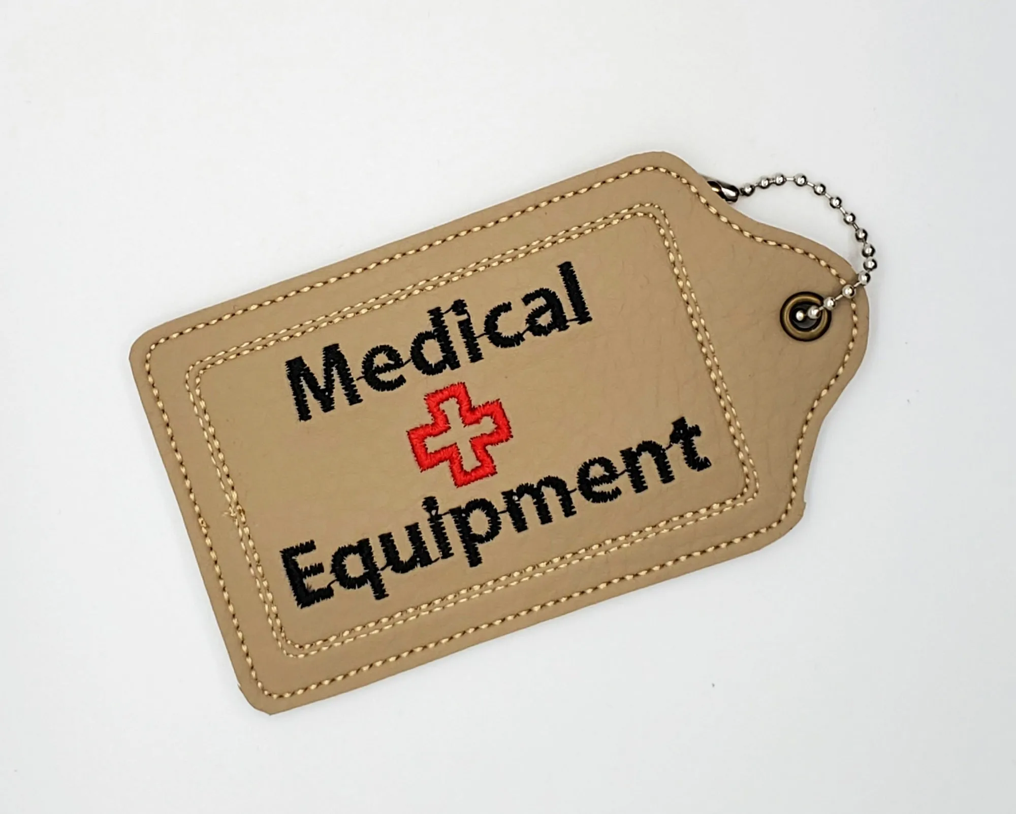 Tan Medical Equipment Luggage Tag with Travel print