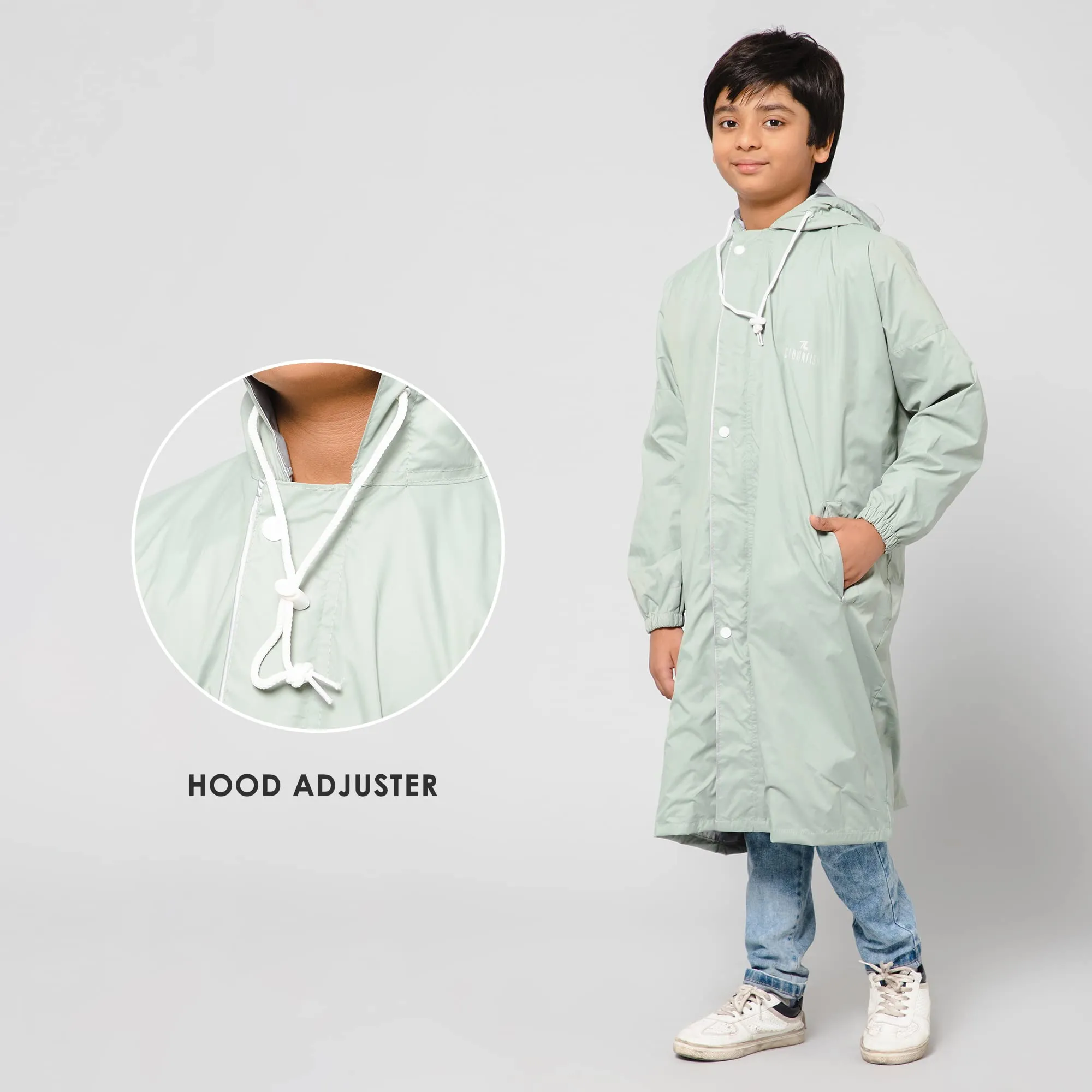 THE CLOWNFISH Cloud Chaser Series Kids Raincoat Waterproof Polyester Double Coating Reversible Longcoat with Hood and Reflector Logo at Back. Printed Plastic Pouch. Kid Age-5-6 years (Pista Green)